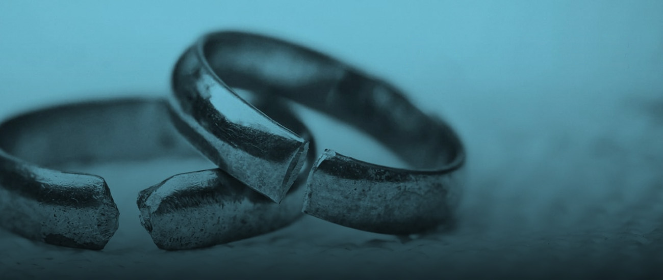 Two rings displayed on a blue background, highlighting their design and color contrast.